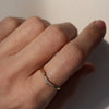 Wearing Leave To Dry Graduating Diamond Ring by Pernille Holm